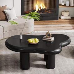 a living room with a couch, table and fireplace in the backgrounge