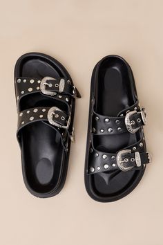 The Devaney Black Studded Western Buckle Slide Sandals were made for effortless styling, so you can spend more time out in the sun having fun! These faux leather sandals feature an almond-shaped footbed and wide adjustable straps embellished with silver studded details and Western-inspired buckles and tips with intricate embossing. A contoured insole completes the simple slide-on design. 0. 75" rubber sole. Smooth insole. Rubber sole has nonskid markings. Man made materials. Imported. Lulus | De Western Buckles, Spring Break Outfit, Almond Shaped, Buckle Sandals, Time Out, Shoe Game, Having Fun, Flat Sandals, Slide Sandals