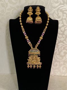 Experience the divine beauty and cultural significance of India with our Goddess Laxmi pendant necklace. Crafted with intricate detail and cultural significance in mind, this necklace features a stunning Laxmi pendant, representing prosperity and success. Elevate your style and connect with ancient traditions with this traditional Indian jewelry piece. Temple Necklace, Goddess Laxmi, Traditional Indian Jewellery, Divine Beauty, Goddess Dress, Kundan Earrings, Cz Earrings, Finger Rings, Antique Earrings