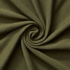 an olive green fabric with a spiral design