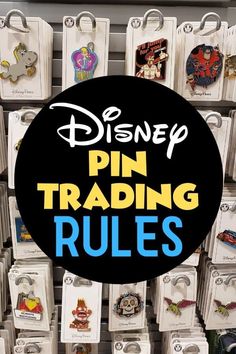 pin trading rules are displayed in front of the disney logo and other pins on display