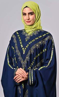 The embroidered kaftan, a masterpiece that seamlessly blends tradition and modernity. Crafted with the utmost attention to detail, this kaftan is a true embodiment of elegance and sophistication.The sleeves are adorned with meticulously crafted trims that add a touch of opulence and charm.The abaya itself maintains its characteristic loose and flowing silhouette, designed to provide modesty and comfort to the wearer.These trims are a work of art on their own, featuring a combination of metallic threadwork, sequins, and bead embellishments. The trims gracefully wind along the edges of the sleeves, catching the light with every movement and exuding an air of refined luxury.It's a harmonious blend of classic style and contemporary flair, designed to make you feel like royalty with every step Embroidered Kaftan, Classic Style, Embellishments, Full Length, Royalty, Art