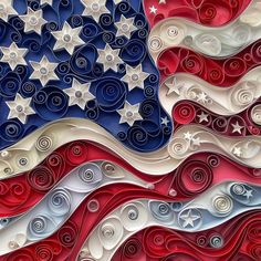 an american flag made out of red, white and blue paper with swirls on it