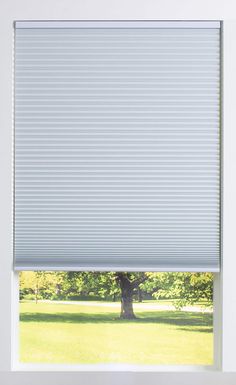 a large window with an open cellular shades