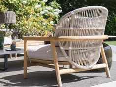 a wicker chair sitting on top of a patio