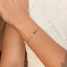 I N T E R L O C K I N G ∙ C I R C L E S ∙ B R A C E L E T Let the interlocking circles on this minimalist bracelet represent the way you and your loved one are linked. The perfect anniversary gift, our mixed metal charm bracelet represents eternity and love to show that special someone they are forever.  * Material: High Quality Solid 925 Sterling Silver.   * Finish: Sterling Silver ∙ 18K Gold * Chain length: Adjustable from ~6 to 7.5 inches. * Featuring ~3cm Linked Circles Charm. O T H E R ∙ I Yellow Gold Infinity Bracelets For Everyday, Modern Everyday Charm Bracelet, Yellow Gold Infinity Bracelet For Everyday, Minimalist Round Hypoallergenic Charm Bracelet, Minimalist Hypoallergenic Round Charm Bracelet, Hypoallergenic Minimalist Charm Bracelet, Minimalist Rose Gold Charm Bracelet For Everyday, Minimalist Round Charm Bracelet For Everyday, Minimalist Infinity Bracelet With Adjustable Chain