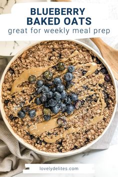 blueberry baked oats in a white bowl with spoons