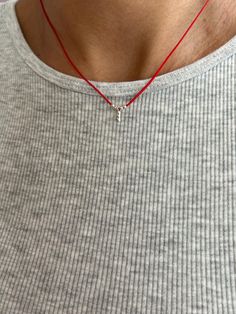 This handmade necklace features a striking combination of red cord, silver beads, and a single charm. The vibrant red cord serves as a bold base, contrasting beautifully with the elegant silver beads that add a touch of sophistication. The charm, carefully selected for its unique design, completes the piece, making it a standout accessory. Ideal for adding a pop of color and style to any outfit, this necklace is perfect for both casual and formal occasions. Its handcrafted nature ensures each pi Nylon Cord Necklace, Red String Necklace, Wish Necklace, Ear Cuff Jewelry, String Necklace, Minimal Necklace, Red String, Leather Corded Necklace, Cuff Jewelry