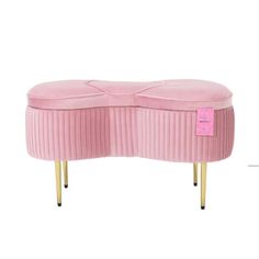 a pink bench with gold legs and a label on the bottom that says,'i love