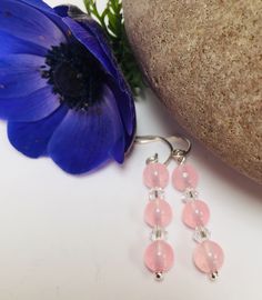 These elegant earrings are made from sterling silver with pretty pastel pink rose quarz gemstones and Swarovski crystals. They have handcrafted sterling silver fittings. The perfect gift for any occasion. Rose Quartz brings the energy rays of determination, commitment, and caring. Its soothing colour calms feelings of anger or resentment, and can aid efforts to meditate and reflect. Pink is the colour of new love, new romance and new relationships. Earring Drop - 4 cm (1.5 inches) All measurements are approximate. All items are wrapped in tissue paper, inside an organza bag and posted in a padded envelope. Pink Rose Quartz Jewelry With Ear Wire, Pink Crystal Round Earrings For Gift, Pink Rose Quartz Jewelry With Matching Earrings, Pink Rose Quartz Drop Earrings, Pink Sterling Silver Earrings For Pierced Ears, Handmade Pink Crystal Earrings In Sterling Silver, Handmade Pink Crystal Sterling Silver Earrings, Elegant Nickel-free Rose Quartz Earrings, Pink Gemstone Round Earrings