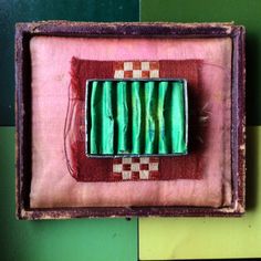 an old box with some green items in it