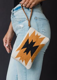 You'll be ready for your everyday outings with our new wristlet! This cream, camel and blackAztec inspired wristlet is just what you need for your upcoming casual outings. Cream, camel and black Aztec inspired wristlet Leather pull Measures 5" x 8" Designed in the U.S.A. Produced in India.  100% Cotton Lining: 100% Polyester Casual Everyday Clutch Wristlet, Handmade Wristlet For Everyday, Adjustable Bohemian Wristlet For Everyday, Adjustable Beige Rectangular Wristlet, Handmade Rectangular Wristlet For Everyday Use, Handmade Clutch Wristlet For Everyday Use, Handmade Pouch Wristlet For Daily Use, Trendy Handmade Wristlet For Everyday, Handmade Trendy Wristlet For Everyday Use