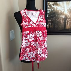 Flowery Tank Top With Tie In The Back. Pit To Pit 12.5" Length 22" Interested In Starting Your Own Closet? Use Code Samanthast2018 When Signing Up For A $10 Credit! Red Sleeveless Playwear Top, Red Sleeveless Top For Playwear, Red Fitted Tops For Playwear, Fitted Red Tops For Playwear, Cotton Floral Print Tops For Playwear, Spring Floral Print Tops For Playwear, Floral Print Tops For Spring Playwear, Justice Shirts, Kids Shirts