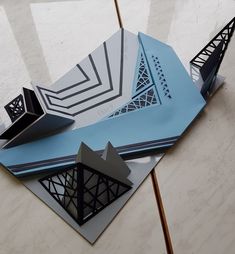 an origami model of the eiffel tower is displayed on a table