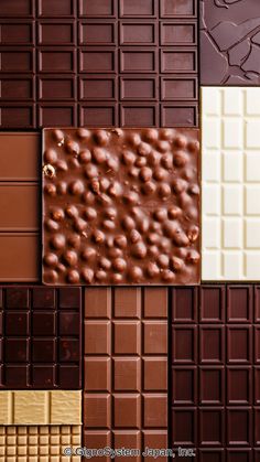 the chocolate is different colors and patterns on the tile wall, but it doesn't look like they are made from real chocolates