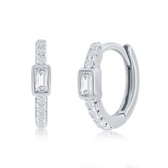 These luxurious sterling silver hoop earrings add an element of sophistication to any ensemble with their baguette Cubic Zirconia  huggie design. An elegant and tasteful choice, this exclusive pair of earrings is sure to add a touch of glamour to any look.11.5mm x 13mm*ENLARGED TO SHOW DETAILClosure:SnapColor:Silver.Main Stone:Cubic ZirconiaMain Stone Color:ClearMain Stone Shape:RoundMain Stone Creation:Lab-CreatedMain Stone Treatment:Not EnhancedSecond Stone:No StoneCustomized:NoHandmade:YesSig Sterling Silver Hoop Earrings, Huggie Hoop Earrings, Sterling Silver Hoops, Fine Jewellery Earrings, Silver Hoops, Silver Hoop Earrings, Fashion Earrings, Stone Color, Cubic Zirconia