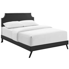 a bed with white sheets and black headboard is shown in front of a white background