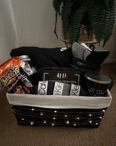 a basket filled with coffee and snacks on the floor