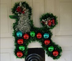 a door decorated with wreaths and lights