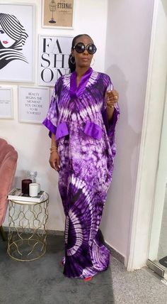 🎈A Vibrant, Brightly Colored Adire Silk dress great for the summer, parties and weddings. This Nigerian made Kaftan Bubu dress is a head turner with a wow-factor for any event you want to attend; it's comfortable, it's chic. This Gorgeous Adire silk dress is made of high quality adire silk (Nigerian tie dye) that feels good on the skin. Look simple, yet sophisticated enough to steal all the attention. 🎈DETAILS  - Sewn from scratch as you order - Can be custom made to fit you (required measurements: Bust, Waist, Hips, Dress Length (or height) -Loose fit with a kaftan silhouette  - Length 58 inches (can be adjusted to your desired length) - Neckline options: V- Neck (has a touch of silk at neckline) -Plain Silk Faux Pockets (not pockets) - A touch of plain silk at the sleeves  - 100% West Summer Purple Maxi Length Gown, Summer Wedding Long Sleeve Kaftan, Silk Bubu Styles Nigerian, Summer Wedding Maxi Length Kaftan, Summer Wedding Maxi Kaftan, Summer Wedding Guest Purple Maxi Dress, V-neck Beach Gown For Summer, Bubu Gown Styles Silk Adire, Silk Kampala Styles