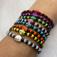 These colorful Halloween skull Stretch bracelets are handcrafted personally for me, Derlis. You can pick your size bracelet. Also, you can pick your favorite style, color combination, with or without skull, and make your own stack. A wonderful gift to your friends, family to wear this Mardi Gras, Halloween season/parties/parades and/or as part of your costume, to go trick or treating, or all year round.  Do not forget to get the matching earrings: https://www.etsy.com/listing/1544063575/hallowee Halloween Skull Print Bracelet Gift, Adjustable Skull Print Bracelet As Gift, Handmade Multicolor Bracelets For Halloween, Novelty Multicolor Beaded Bracelets For Halloween, Halloween Novelty Multicolor Beaded Bracelets, Fun Handmade Black Beaded Bracelets, Handmade Fun Black Beaded Bracelets, Handmade Casual Skull Bracelets, Handmade Casual Skull Bracelet