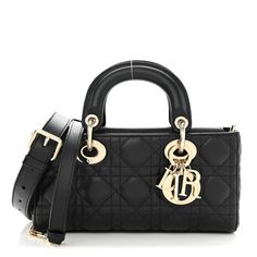 This is an authentic CHRISTIAN DIOR Lambskin Cannage Small Lady D-Joy in Black. This attractive tote is crafted of matte black leather with a geometric pattern throughout the entire bag. The bag features a gold chain leather strap handle, an optional leather shoulder strap, reinforced top handles, and a gold Dior charm. The inner top flap opens to a black microfiber interior with a patch pocket. 30s Birthday, Dior Gift, Birthday 30, Small Lady, Lady Dior Bag, Leather Chain, Lady Dior, Dior Bag, Purses And Handbags