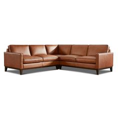 a brown leather sectional sofa with wooden legs and arm rests on an isolated white background