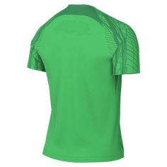 a green shirt with an intricate design on the chest