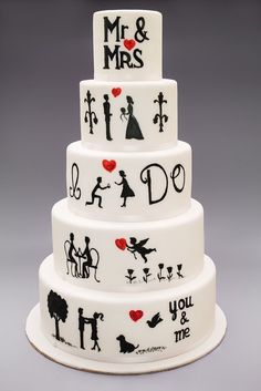 a three tiered wedding cake decorated with black and white silhouettes