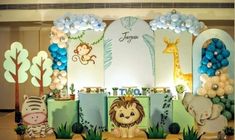 an animal themed birthday party with balloons and decorations