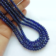 AAA+ Natural Blue Sapphire Necklace|Blue Sapphire Smooth Rondelle Beads Necklace| 100% Natural Blue Sapphire Rondelle Beads|18 Inch Gemstone Gemstone Type :  Natural Blue Sapphire Item Code :   0991# Grade-: AAA++ Stone shape-: Rondelle beads Stone color-: Dark Blue Color Metal-:          Length-: 18 Inch Quantity-: 1 Strand Approx Weight   : 125.30  Carat    Size-: 4 MM to 5.5 MM 100% Genuine & Natural If you want More Quantity in Any Necklace then you can get it in our company.  ABOUT US skgem Blue Oval Gemstone Beads, Blue Gemstone Beads For Gifts, Blue Oval Beads Single Strand, Blue Rondelle Faceted Bead Necklace, Blue Rondelle Beaded Necklace With Faceted Beads, Blue Rondelle Faceted Bead Necklaces, Blue Oval Single Strand Beads, Blue Rondelle Beaded Necklace With Spacer Beads, Sapphire Beaded Necklaces With Faceted Round Beads