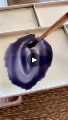 an artist's palette is being used to paint