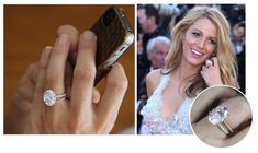 a close up of a person holding a cell phone and wearing a ring with a diamond on it