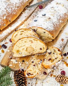 sliced bread with cranberries and nuts on a cutting board