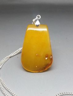 7,4 grams Genuine Natural Butterscotch/Yellow Baltic Amber Pendant Necklace #BalticAmber Handmade Yellow Baltic Amber Necklaces, Handmade Baltic Amber Necklace In Yellow, Handmade Yellow Baltic Amber Necklace, Handmade Yellow Rectangular Jewelry, Classic Yellow Jewelry As Gift, Vintage Yellow Rectangular Jewelry, Classic Yellow Pendant Necklace, Classic Handmade Yellow Jewelry, Vintage Yellow Jewelry As Gift