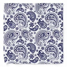 a blue and white bandanna with paisley designs on it