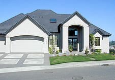 a large house with two car garages on the front and side of it is shown