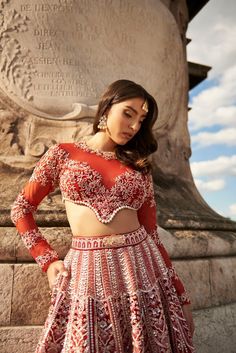 Carnelian Red Lehenga Set- Featuring meticulous hand embroidery and delicate pearl embellishments, the lehenga is crafted from opulent raw silk and velvet. The net full sleeve blouse and dupatta add a touch of sheer elegance.From Jigar Nikita’s 11:11 In Paris collection DELIVERY TIMEPlease allow 8-12 weeks for your outfit to arrive. FABRIC DETAILSLehenga - Raw Silk & Velvet Blouse - Net and Raw Silk, Dupatta - Net Professional cleaning only. Red Anarkali Choli With Long Sleeves, Red Anarkali Lehenga With Long Sleeves, Long Sleeve Red Choli For Diwali, Red Long Sleeve Lehenga With Pallu, Red Long Sleeve Choli For Reception, Wedding Lehenga With Dori Work, Red Long Sleeve Choli With Zari Work, Red Long Sleeve Choli With Pallu, Elegant Long Sleeve Red Choli