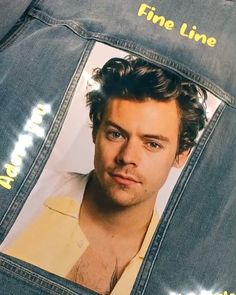 a man's jean jacket with a photo of him in the back pocket and his name on it