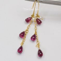 DESCRIPTION: Thank you for coming in! Spectacular 14K 18K solid yellow gold earrings with Seed pearl and finest rhodolite garnet teardrop briolettes! It looks much much nicer in person! DIMENSION: 2.35 Inch Total Length. WEIGHT: Appr. 16.95 Carats MATERIAL: 18K Solid Yellow Gold, Garnet, Seed Pearl Elegant Garnet Briolette Earrings, Elegant Briolette Garnet Earrings, Briolette Earrings, Yellow Gold Earrings, Rhodolite Garnet, Dangly Earrings, Seed Pearl, Yellow Gold Earring, Gold Pearl