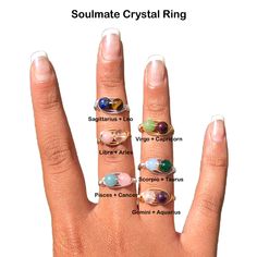 a woman's hand with five different rings on her fingers and the words soulmate crystal ring