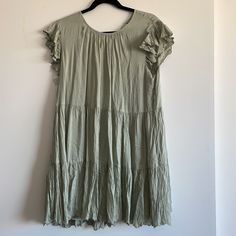 Brand New With Tags Size M Color: Silver Sage Green Flowy Tiered Midi Dress Casual Style, Flowy Tiered Midi Dress Casual, Flowy Tiered Casual Midi Dress, Rayon Mini Dress With Ruffles, Rayon Sundress With Ruffles, Casual Midi Length Dress With Ruffle Hem, Ruffled Rayon Mini Dress, Spring A-line Rayon Midi Dress, Mid-length Ruffled Dresses For Spring