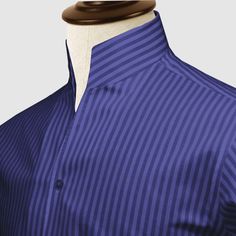 "High Open Collar Full Sleeves Shirt Tailor-Made On Order shirt 𝘈 𝘩𝘪𝘨𝘩 𝘤𝘰𝘭𝘭𝘢𝘳 𝘴𝘩𝘪𝘳𝘵 𝘪𝘴 𝘢 𝘤𝘭𝘢𝘴𝘴𝘪𝘤 𝘢𝘯𝘥 𝘵𝘪𝘮𝘦𝘭𝘦𝘴𝘴 𝘴𝘵𝘺𝘭𝘦 𝘵𝘩𝘢𝘵 𝘢𝘥𝘥𝘴 𝘢 𝘵𝘰𝘶𝘤𝘩 𝘰𝘧 𝘴𝘰𝘱𝘩𝘪𝘴𝘵𝘪𝘤𝘢𝘵𝘪𝘰𝘯 𝘵𝘰 𝘢𝘯𝘺 𝘰𝘶𝘵𝘧𝘪𝘵. 𝘛𝘩𝘪𝘴 𝘴𝘵𝘺𝘭𝘦 𝘧𝘦𝘢𝘵𝘶𝘳𝘦𝘴 𝘢 𝘤𝘰𝘭𝘭𝘢𝘳 𝘵𝘩𝘢𝘵 𝘴𝘵𝘢𝘯𝘥𝘴 𝘶𝘱 𝘢𝘯𝘥 𝘦𝘯𝘤𝘪𝘳𝘤𝘭𝘦𝘴 𝘵𝘩𝘦 𝘯𝘦𝘤𝘬, 𝘱𝘳𝘰𝘷𝘪𝘥𝘪𝘯𝘨 𝘢 𝘳𝘦𝘧𝘪𝘯𝘦𝘥 𝘢𝘯𝘥 𝘱𝘰𝘭𝘪𝘴𝘩𝘦𝘥 𝘭𝘰𝘰𝘬. 𝘐𝘵'𝘴 𝘢 𝘷𝘦𝘳𝘴𝘢𝘵𝘪𝘭𝘦 𝘱𝘪𝘦𝘤𝘦 𝘰𝘧 𝘤𝘭𝘰𝘵𝘩𝘪𝘯𝘨 𝘵𝘩𝘢𝘵 𝘤𝘢𝘯 𝘣𝘦 𝘸𝘰𝘳𝘯 𝘸𝘪𝘵𝘩 𝘢 𝘴𝘶𝘪𝘵 𝘧𝘰𝘳 𝘧𝘰𝘳𝘮𝘢𝘭 𝘰𝘤𝘤𝘢𝘴𝘪𝘰𝘯𝘴 𝘰𝘳 𝘥𝘳𝘦𝘴𝘴𝘦𝘥 𝘥𝘰𝘸𝘯 𝘸𝘪𝘵𝘩 𝘫𝘦𝘢𝘯𝘴 𝘧𝘰𝘳 𝘢 𝘤𝘢𝘴𝘶𝘢𝘭 𝘭𝘰𝘰𝘬. 𝘛𝘩𝘦 𝘩𝘪𝘨𝘩 𝘤𝘰𝘭𝘭𝘢𝘳 𝘢𝘭𝘴𝘰 𝘰𝘧𝘧𝘦𝘳𝘴 𝘢𝘥𝘥𝘪𝘵𝘪𝘰𝘯𝘢𝘭 𝘤𝘰𝘷𝘦𝘳𝘢𝘨𝘦 𝘢𝘯𝘥 𝘱𝘳𝘰𝘵𝘦𝘤𝘵𝘪𝘰𝘯 𝘢𝘨 Blue Top With Concealed Placket And Spread Collar, Blue Collared Top For Business, Classic Navy Semi-formal Tops, Classic Fitted Navy Dress Shirt, Elegant Shirt With Stand Collar And Buttons, Classic Blue Top With Concealed Placket, Elegant Stand Collar Shirt With Buttons, Semi-formal Blue Collared Tops, Blue Dress Shirt With Concealed Placket