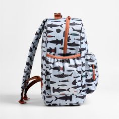 Dive into deep-sea fun with a fun and functional backpack that's built to handle all the thrills of the day. A friendly crew of sharks and fish decorate the bag's light blue exterior, and a contrasting trim gives it the perfect finish. Constructed of supremely durable polyester fabric that includes recycled plastic bottles, this large knapsack's roomy interior holds everything your kid needs-books, school supplies, extra layers-and there's a padded pocket to keep their tablet protected. Outside Kids Pencil Case, Books School, Blue Exterior, Functional Backpack, Toddler Backpack, Kids Gear, Kids Backpack, Contrasting Trim, Kids Lunchbox