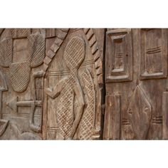 carvings on the side of a wooden wall