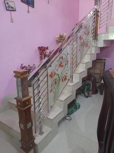 the stairs are decorated with flowers and glass railings