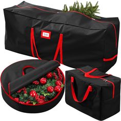 two black duffle bags with red trimmings and christmas decorations in the bottom