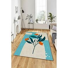 a living room with hardwood floors and white walls, an area rug with flowers on it