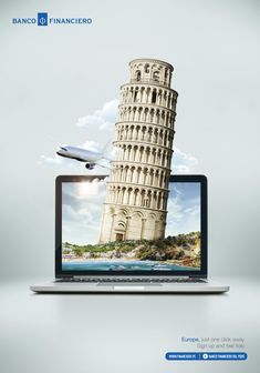 a laptop computer sitting on top of a desk with an image of a leaning tower