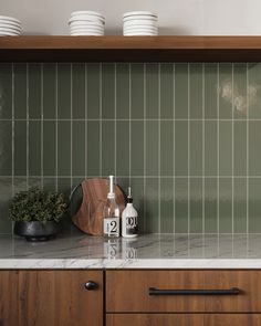 the kitchen counter is clean and ready to be used for cleaning dishes, cups, and utensils